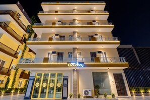 A multi-story hotel with a prominent 'Cloudbay' sign, balconies, and a modern architectural design. - Cloud Bay Hotels - Sector 69 (Gurugram)
