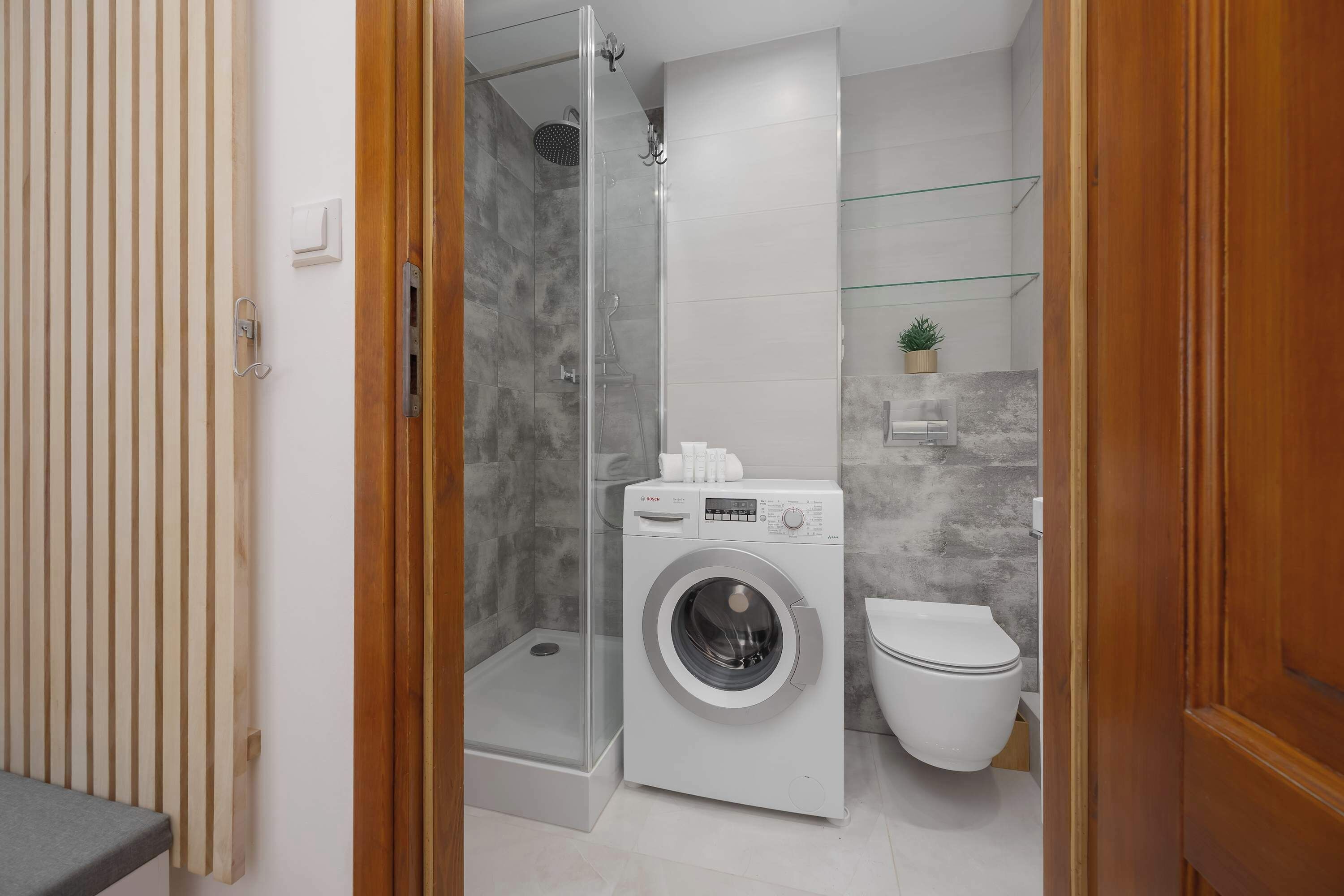 Shower, hair dryer, towels, shampoo