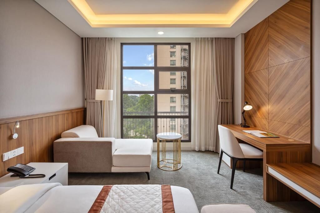 Family Quadruple Room, City View | In-room safe, desk, laptop workspace, soundproofing