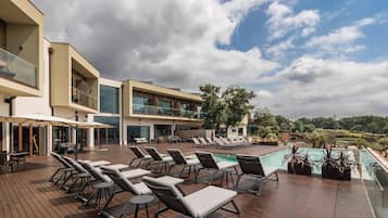 Seasonal outdoor pool, pool umbrellas, pool loungers