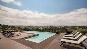 Seasonal outdoor pool, pool umbrellas, sun loungers
