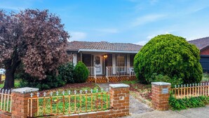 A single-story house with a front porch, a brick fence, and a well-maintained lawn. - Well-Located St Albans Stay with Fully Equipped Kitchen (Saint Albans)
