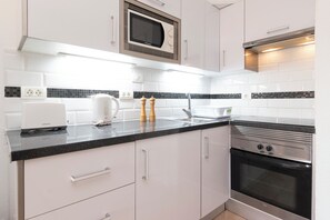 Fridge, microwave, oven, stovetop - Lovely 1 Bedroom Apartment. Communal Heated Pool (CN)