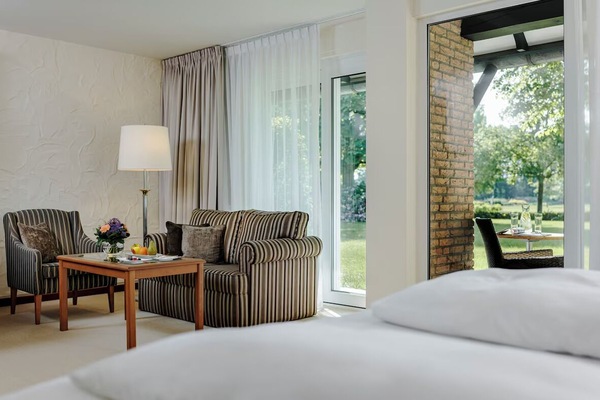 Unwind on the sofa with garden views and fresh air.