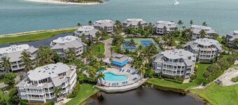 Enjoy golf course & gulf water views at 1666 Lands End Village, a 3-bedroom, 3-bath Captiva condo just a quick walk to Sunset Beach. Guests have access to the association pool, BBQ grills, and pickleball & tennis court. 5-night minimum.