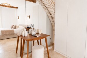 A modern interior with a wooden table, white furniture, and a staircase. - New -Vieil Antibes Remparts -Rare House 3CHR/3SDB (Antibes)