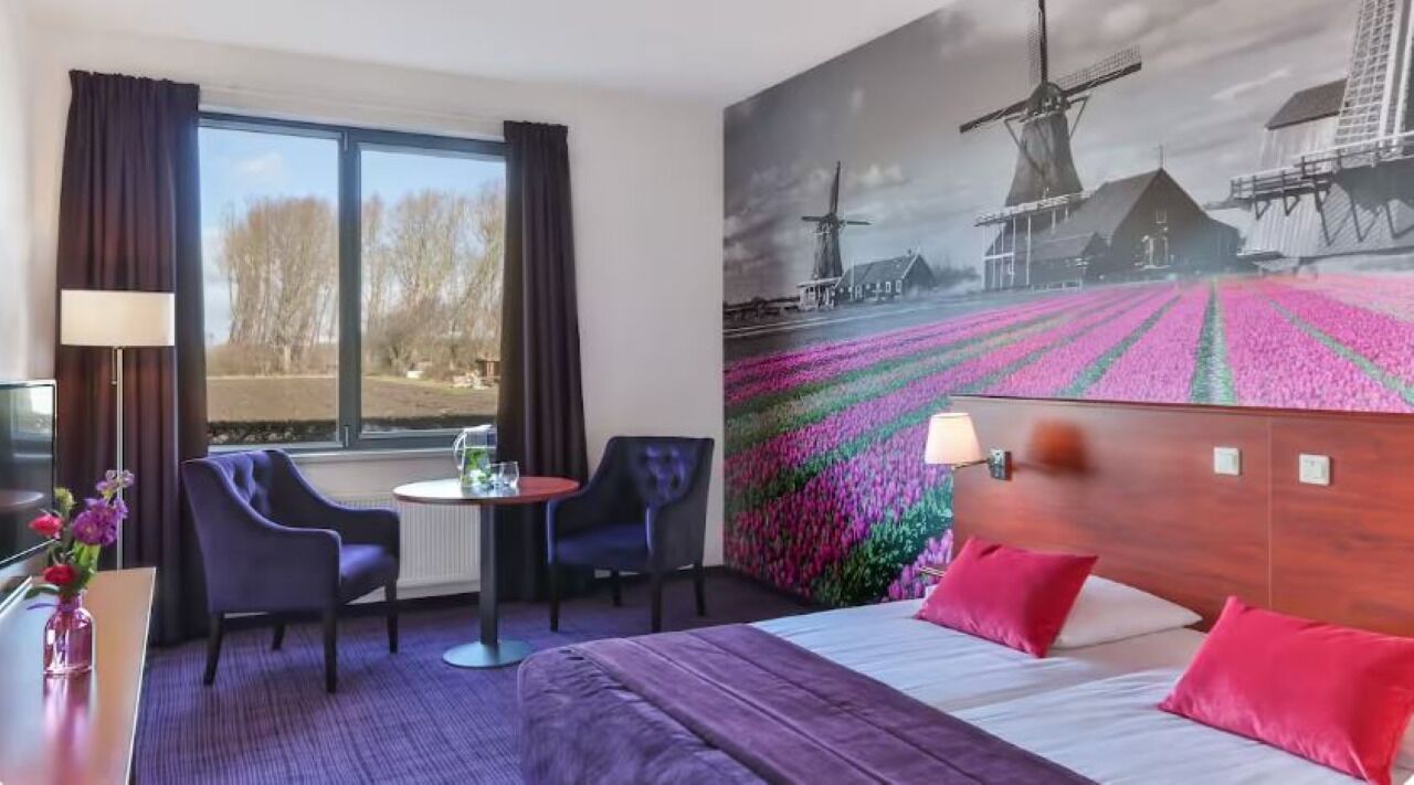 Wake up inspired by vibrant mural views and plush bedding.