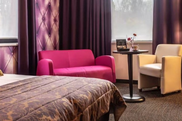 Lounge comfortably on the sofa before sinking into bed.