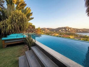 A swimming pool with a view of a mountainous landscape. - Adults only Luxe 3br La Ropa Oasis w/ ccean view (Zihuatanejo)