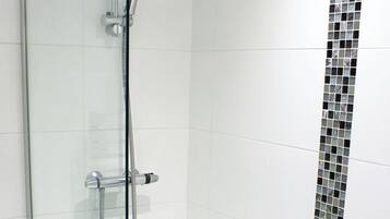 Shower, hair dryer, towels, toilet paper