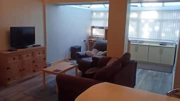 Apartment, 1 Bedroom, Garden View | Living room | Books