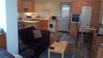 Apartment, 1 Bedroom, Garden View | Living area | Books