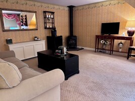 Suite superior, 1 cama de matrimonio grande con sofá cama | Zona de estar