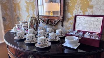 A table with tea sets and a menu detailing tea varieties.