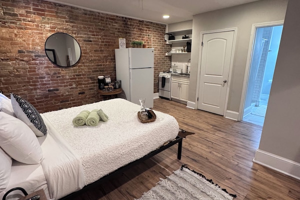 Premium bedding, memory foam beds, laptop workspace, blackout drapes