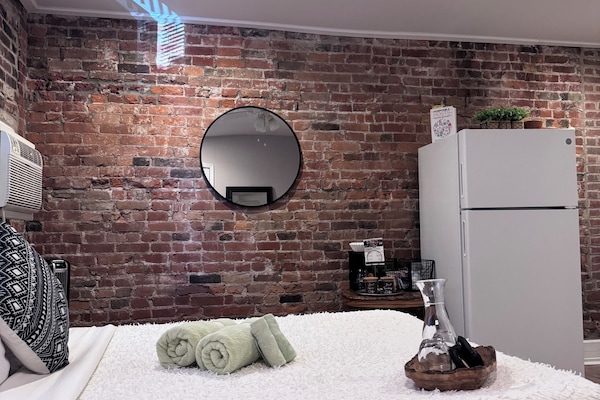 Premium bedding, memory foam beds, in-room safe, laptop workspace