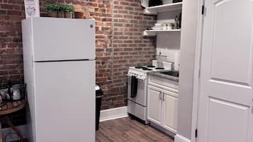 Espresso maker, coffee/tea maker, full-sized fridge, microwave