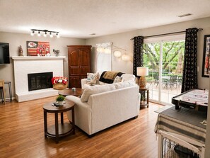 TV, fireplace - World Cup Retreat | Pool • Sleeps 8 • KC (Kansas City)