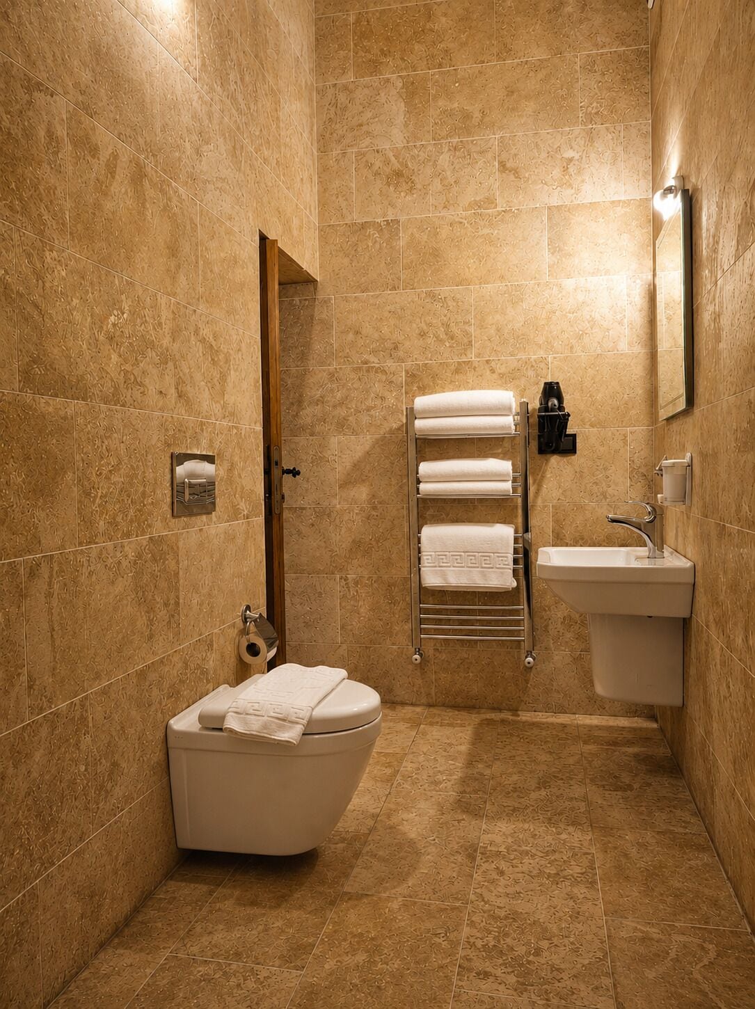 A bathroom with a bathtub, a sink, and a towel rack.