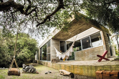 CASA LOBO- La Pedrera A contemporary refuge between the forest and the sea.