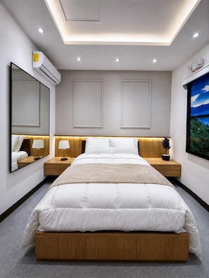 A modern bedroom with a central bed, bedside tables, a large mirror, an air conditioning unit, and a ceiling light.