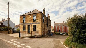 A two-story stone building with a flat roof and a small front porch. - Host & Stay | The Apartment, Mulgrave House (Hinderwell)