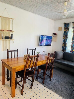 Deluxe House, Garden View | Living area | 32-inch Smart TV with digital channels - Savita House Diani (Diani Beach)