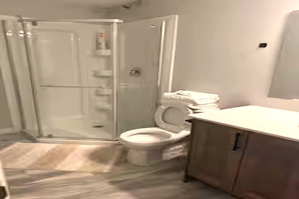 Shower, towels, soap, toilet paper