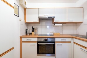 Comfort Apartment, Multiple Beds, Air conditioning, River View | Private kitchen | Full-size fridge, microwave, oven, stovetop