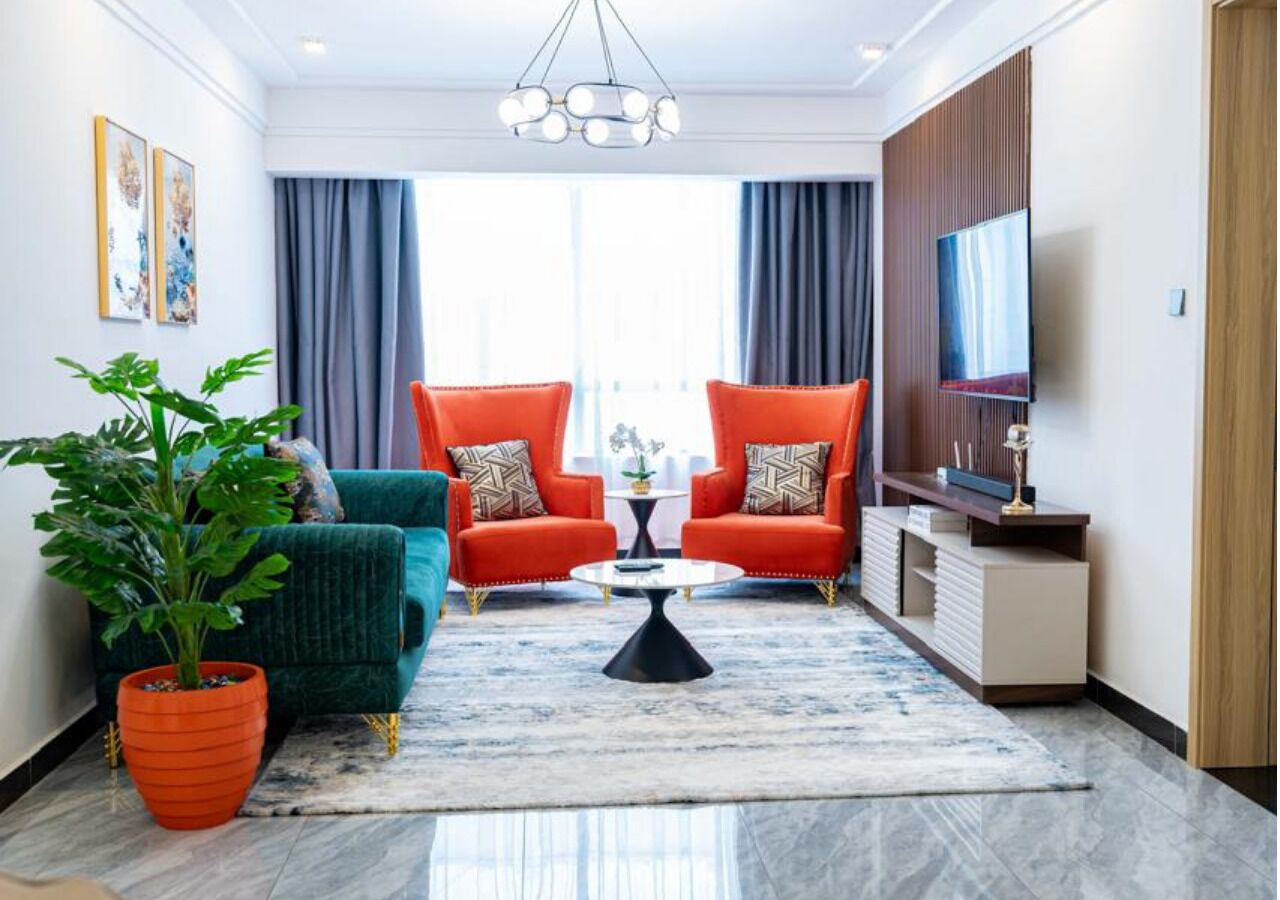 Apartamento superluxo, vista para a cidade | Área de estar | Smart TV 52 polegadas com canais via satélite, Netflix