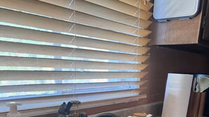 A kitchen sink with a faucet, a soap dispenser, and a paper towel holder. - Cozy 1-bedroom villa in gorgeous Green Valley with AC (Green Valley)