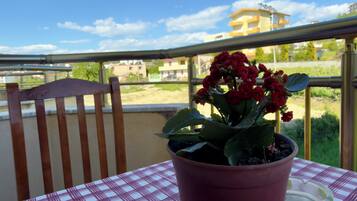Comfort Triple Room, Balcony, Garden View | Outdoor dining