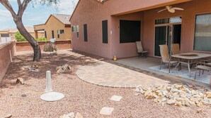 A residential outdoor area with a patio, seating, and a tree. - NEW Canoa Ranch Retreat (Green Valley)