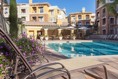 Verdant 2BR Escape with Pool & Lounge