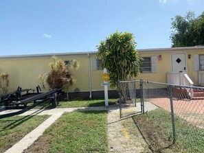 A yellow building with a sign indicating a cabin.
