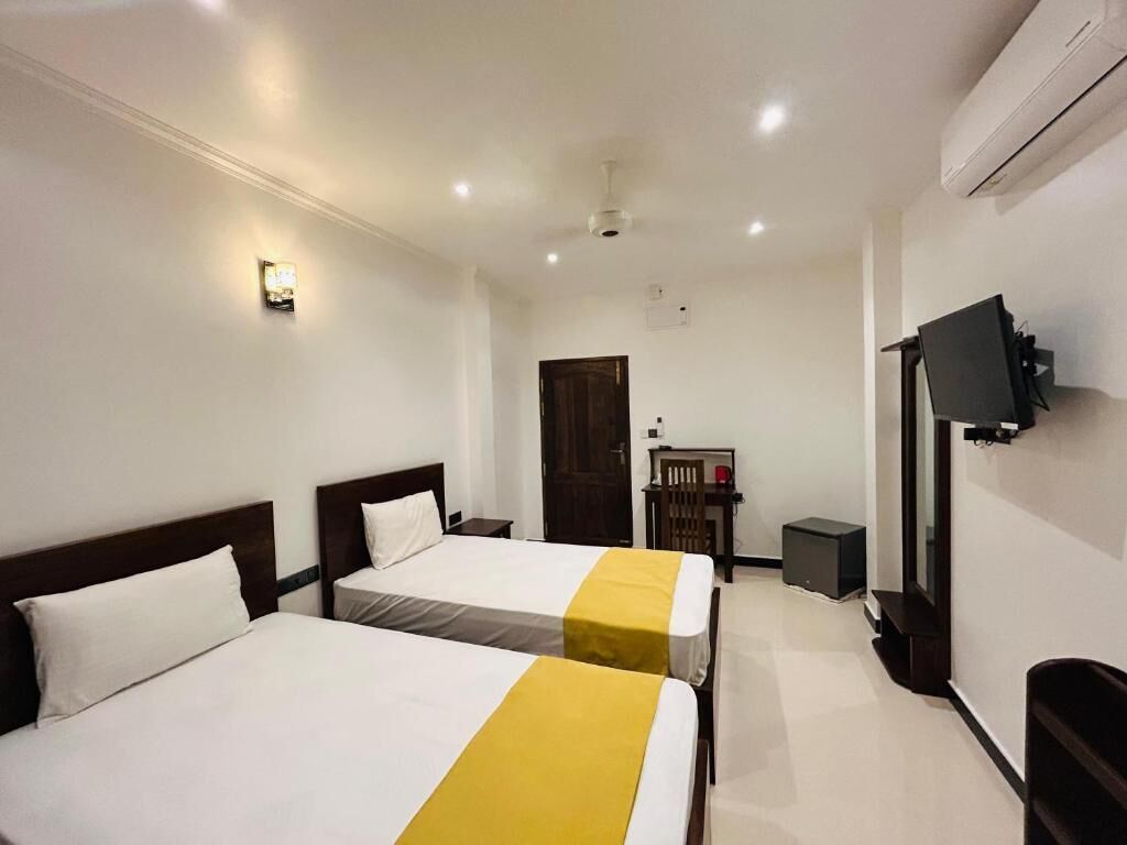 Deluxe Triple Room, Balcony, Garden View
