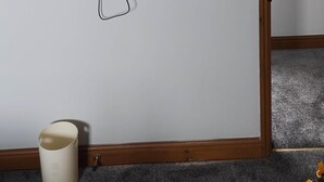 A flat-screen TV mounted on a wall with a power cord and a wall socket below it. - Lovely 3-bedroom house near Robin Hood's Bay perfect for relaxing peaceful break (Robin Hood's Bay)