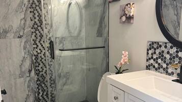 Shower, hair dryer, towels, soap
