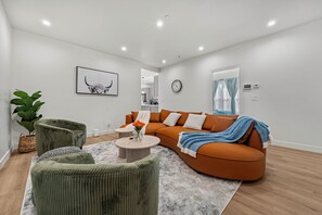Premium House, Multiple Bedrooms, Air conditioning, Garden Area | Living area | 55-inch LED TV with digital channels - Spacious 8BR Home with AC & Parking (Hayward)