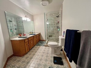 Shower, hair dryer, towels, soap