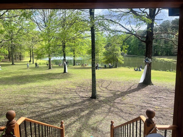A park with picnic tables and people.