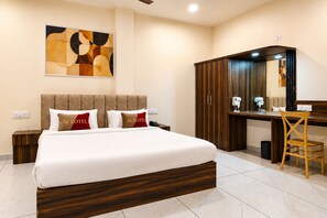 A hotel room with a bed, a desk, and a wardrobe. - Aceotel Select Florence, Ujjain (Ujjain)