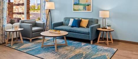 Unwind on plush seating in a bright, stylish lounge.