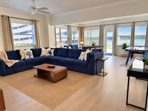 A modern living room with a sectional sofa, a coffee table, and a pool table. - Premium Oversized Vacation Condo! Steps to the Broadwalk & Beach.
Game Lounge. (Hollywood)