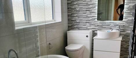 Shower, hair dryer, towels, soap