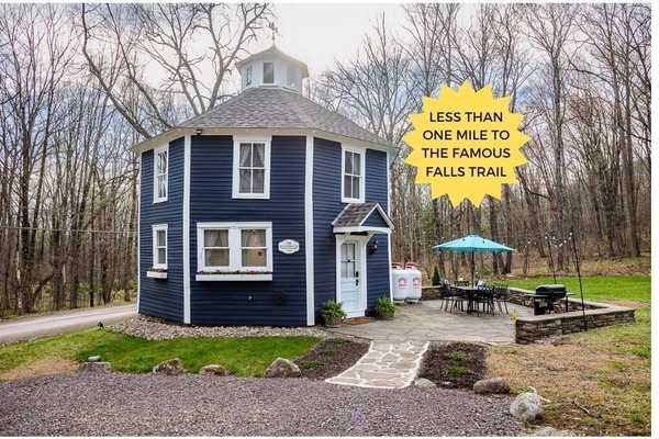 This unique 1880's octagon house boasts a large flagstone patio with lots of seating and a propane grill.