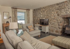 Living area - A secluded Skye boathouse where rugged beauty meets refined coastal living. (Skye)