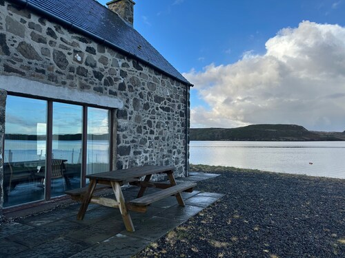 A secluded Skye boathouse where rugged beauty meets refined coastal living.