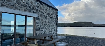 A secluded Skye boathouse where rugged beauty meets refined coastal living.