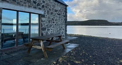 A secluded Skye boathouse where rugged beauty meets refined coastal living.